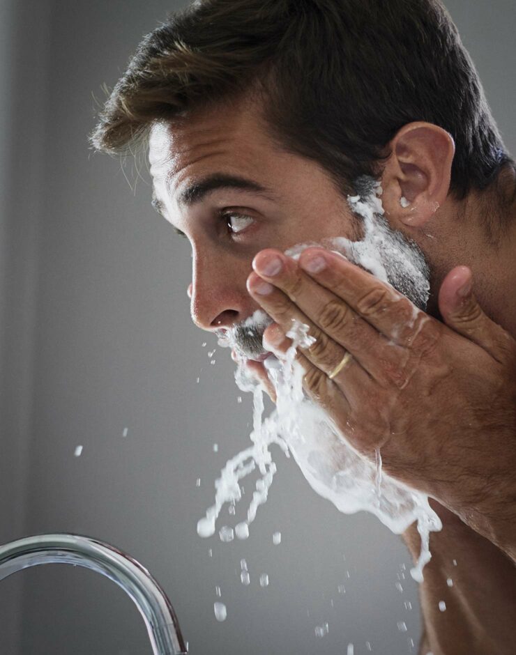 Man washing face.