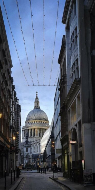 View of St Pauls Cathedral from Watling Street in the City of London.