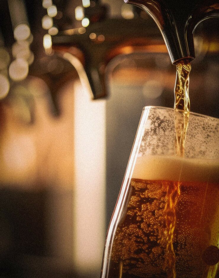 Pouring beer from a tap.