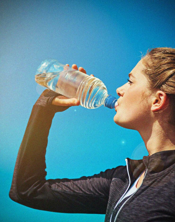 Runner drinking a bottle of water.