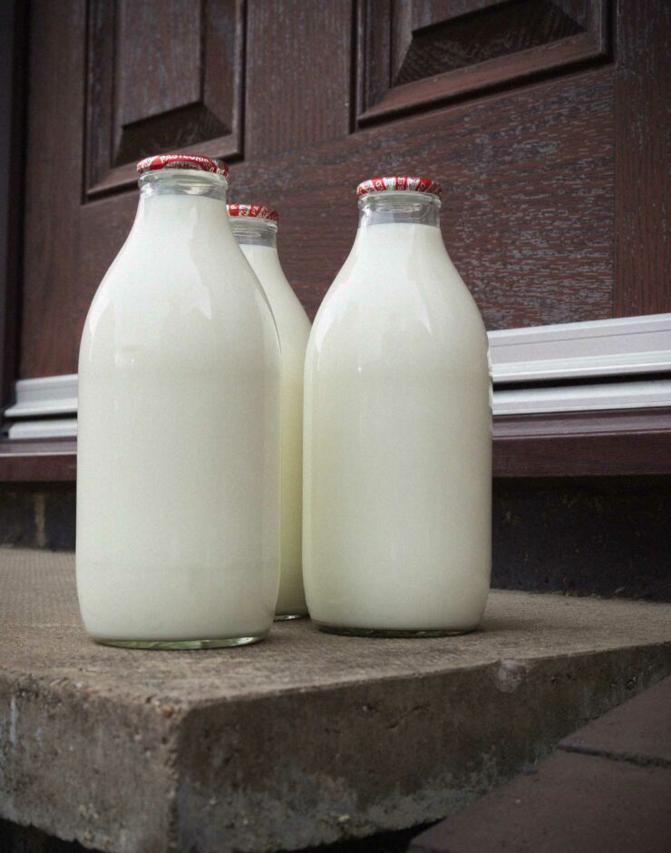 Bottles of milk on a doorstep.