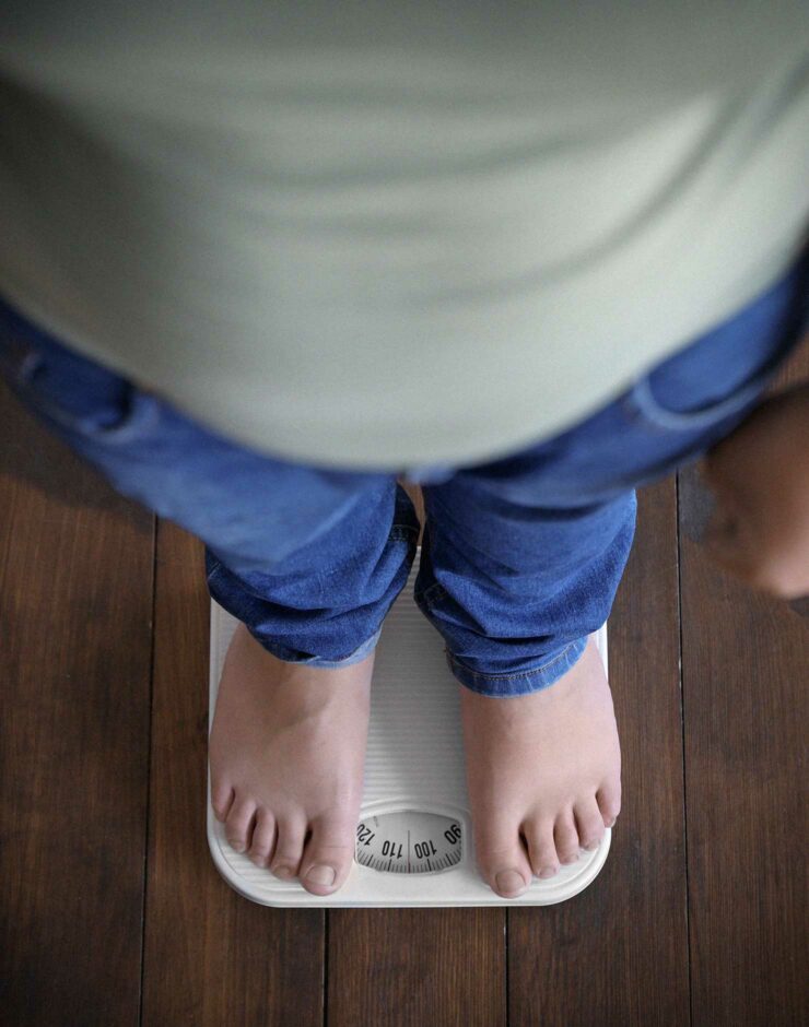 Child standing on scales.