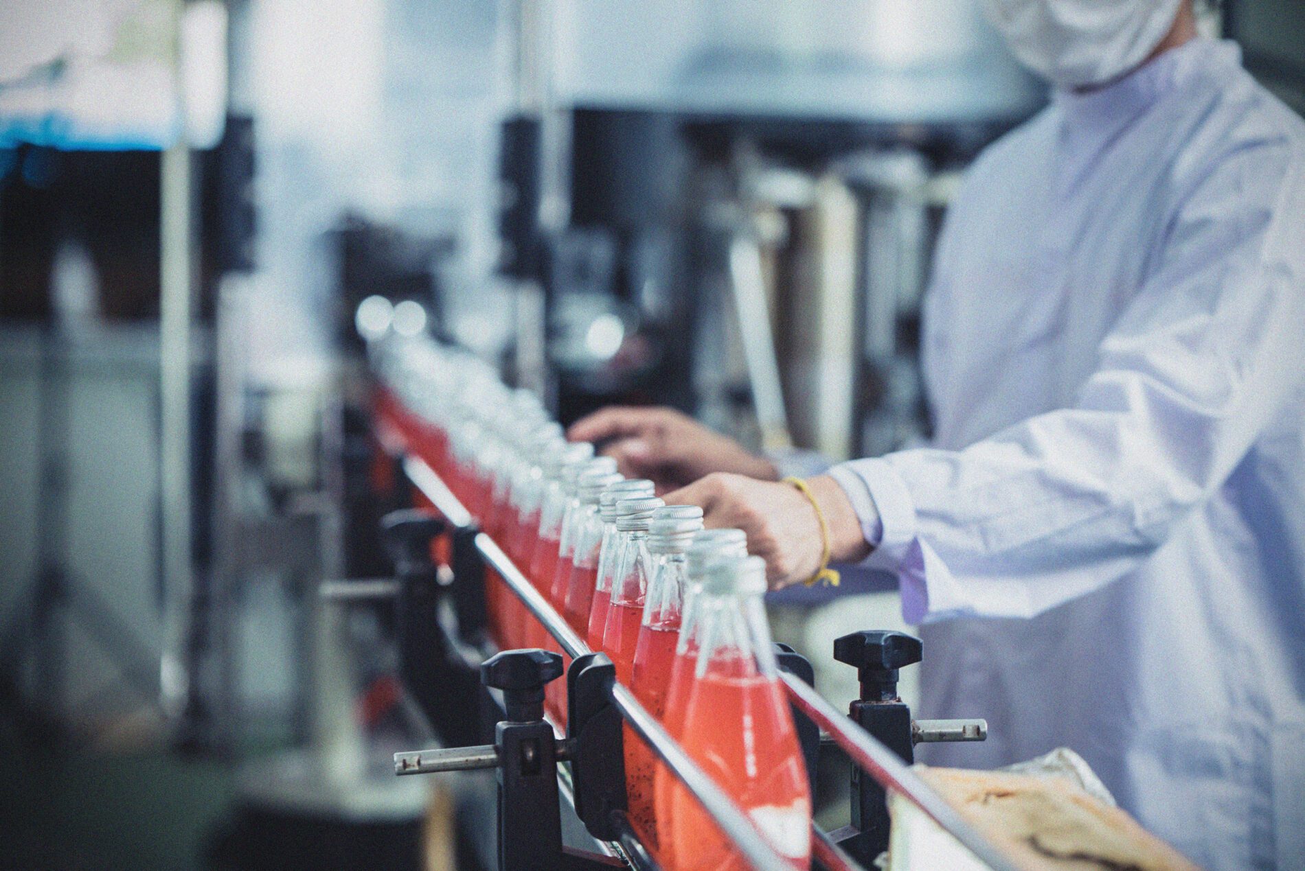 Fizzy drinks in a factory bottling line.