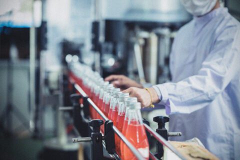 Fizzy drinks in a factory bottling line.
