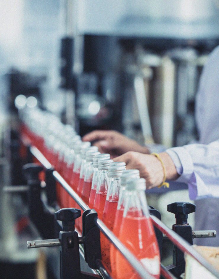 Fizzy drinks in a factory bottling line.