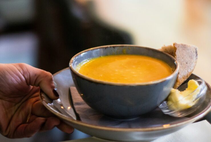 Carrot soup with bread and butter.