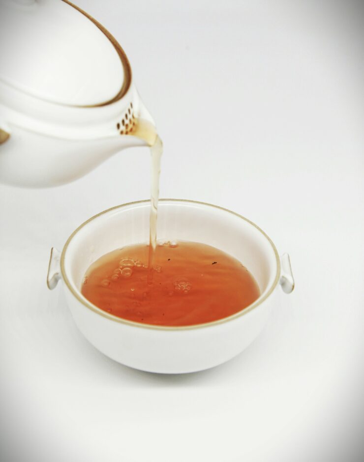 Tea being poured into a teacup.