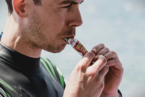 Man consuming sports gel