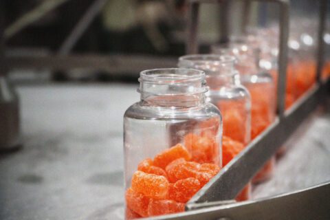 Jars of sweets in a factory.